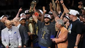 Jun 13, 2026; San Antonio, Texas, USA; New York Knicks guard Jalen Brunson holds the Finals MVP trophy during the championship celebration after game five of the 2026 NBA Finals against the San Antonio Spurs at Frost Bank Center. Mandatory Credit: Geoff Burke-Imagn Images