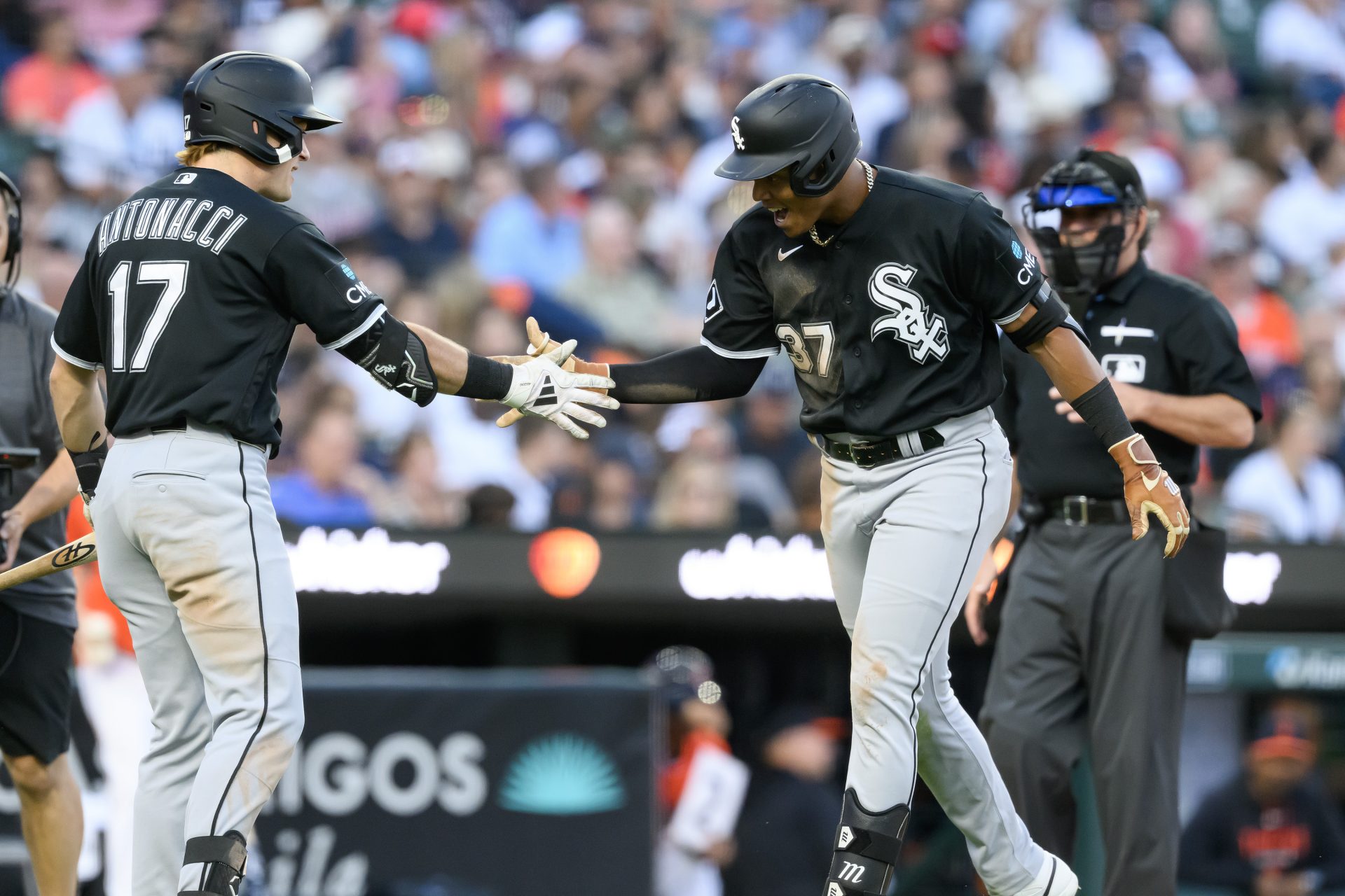 Jun 19, 2026; Detroit, Michigan, USA; Chicago White Sox right fielder Junior Perez (37) celebrates at home plate with White Sox left fielder Sam Antonacci (17) after hitting a solo home run against the Detroit Tigers in the sixth inning at Comerica Park.