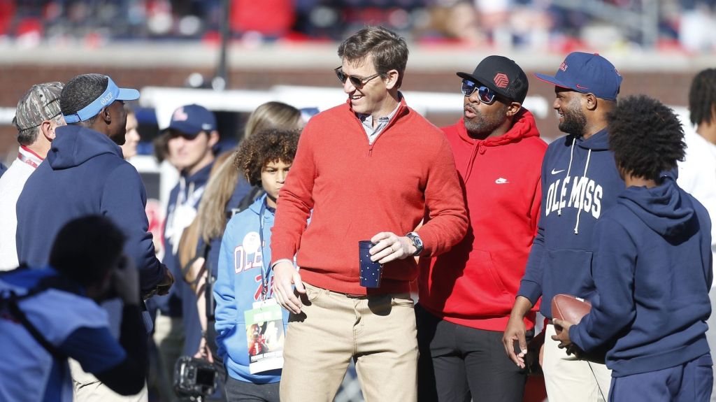Dec 20, 2025; Oxford, MS, USA; Eli Manning former Mississippi Rebels quarterback and NFL star visits the field prior to a game against the Tulane Green Wave at Vaught-Hemingway Stadium.