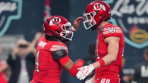 Dec 31, 2025; Las Vegas, NV, USA; Utah Utes quarterback Devon Dampier (4) and tight end JJ Buchanan (81) celebrate after a touchdown against the Nebraska Cornhuskers in the first half during the SRS Distribution Las Vegas Bowl at Allegiant Stadium. Mandatory Credit: Kirby Lee-Imagn Images