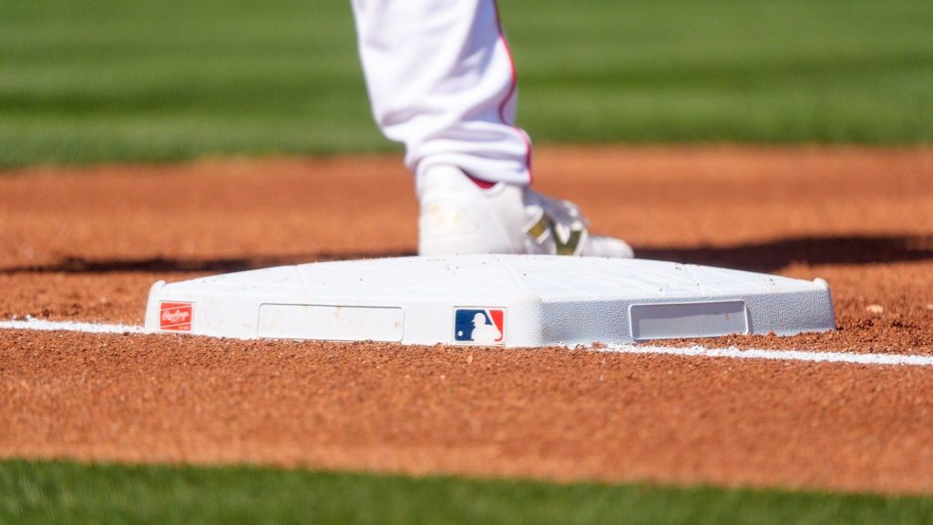 Feb 24, 2026; Tempe, Arizona, USA; Los Angeles Angels A general view of the MLB logo and first base during the first inning of a spring training game between the San Francisco Giants and Los Angeles Angels at Tempe Diablo Stadium. Mandatory Credit: Allan Henry-Imagn Images