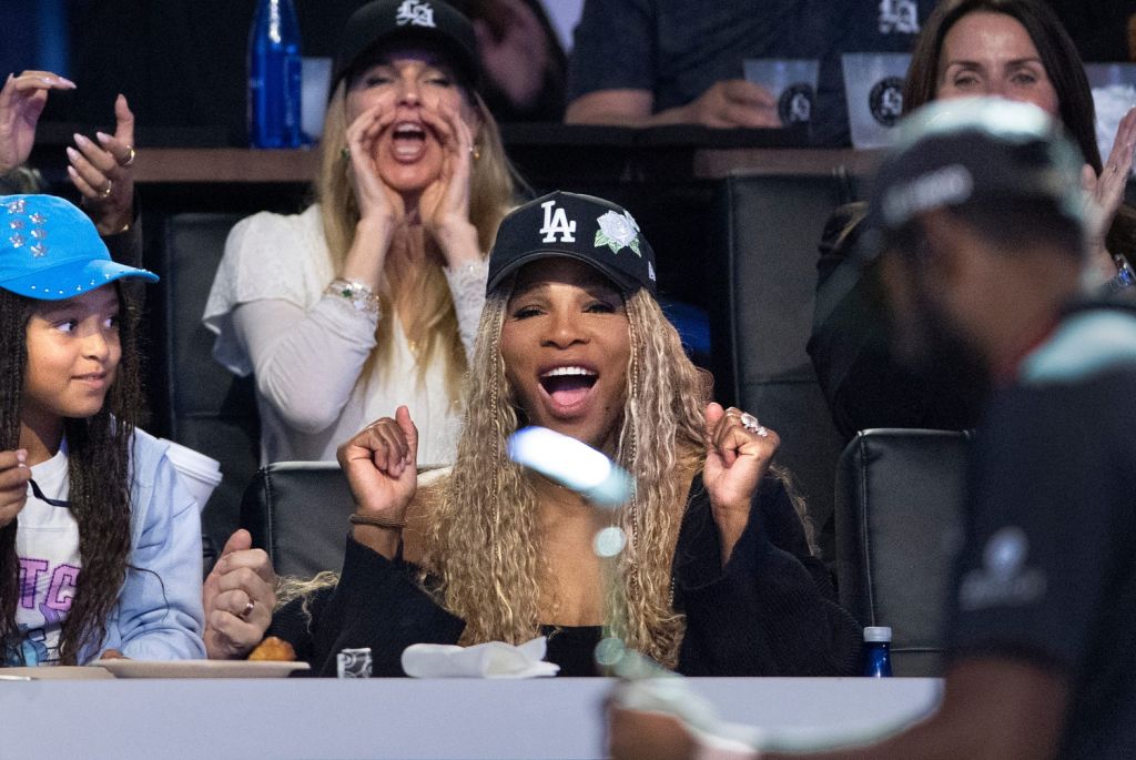 Serena Williams with her daughter Olympia, left, cheers for the Los Angeles Golf Club who won the TGL finals against Jupiter Links GC at SoFi Center on March 24, 2026, in Palm Beach Gardens, Florida.