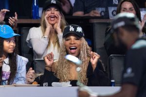 Serena Williams with her daughter Olympia, left, cheers for the Los Angeles Golf Club who won the TGL finals against Jupiter Links GC at SoFi Center on March 24, 2026, in Palm Beach Gardens, Florida.