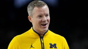 Michigan Wolverines head coach Dusty May talks with his team Monday, April 6, 2026, during the NCAA men's basketball tournament national championship game against the UConn Huskies at Lucas Oil Stadium in Indianapolis.