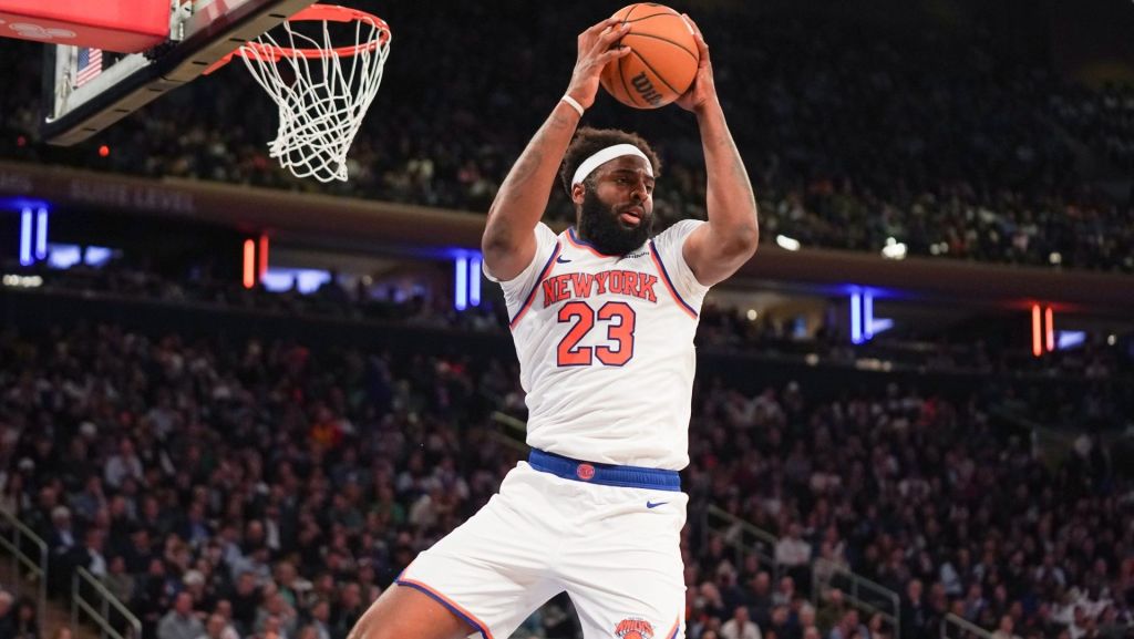 Apr 9, 2026; New York, New York, USA; New York Knicks center Mitchell Robinson (23) secures a rebound during the fourth quarter against the Boston Celtics at Madison Square Garden. Mandatory Credit: Lucas Boland-Imagn Images