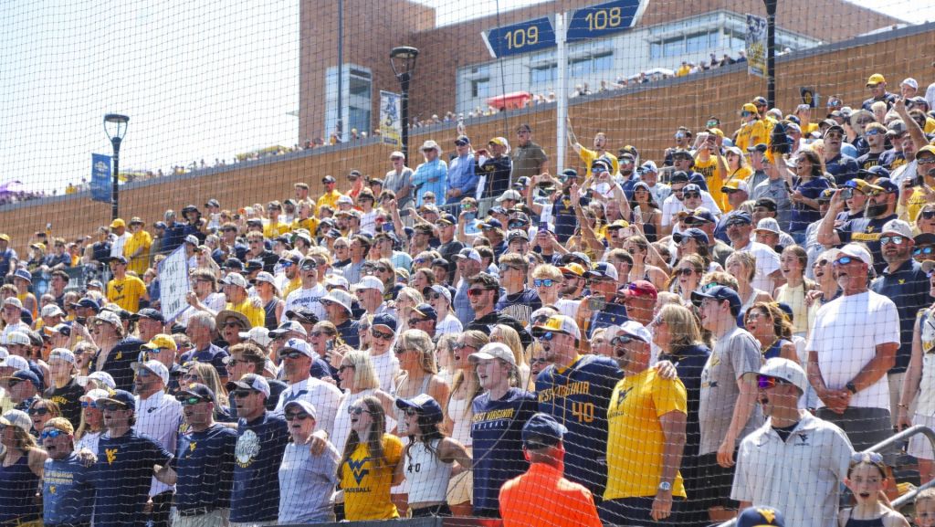 Jun 5, 2026; Morgantown, WV, USA; West Virginia Mountaineers fans sing “Country Roads” after defeating the Cal Poly Mustangs at Kendrick Family Ballpark. Mandatory Credit: Ben Queen-Imagn Images