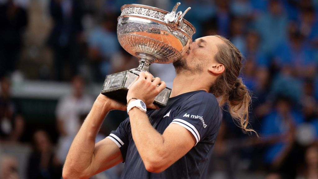 Jun 7, 2026; Paris, France; Alexander Zverev of Germany kisses the trophy after winning the men’s singles final against Flavio Cobolli of Italy on day 15 at Stade Roland Garros. Mandatory Credit: Susan Mullane-Imagn Images