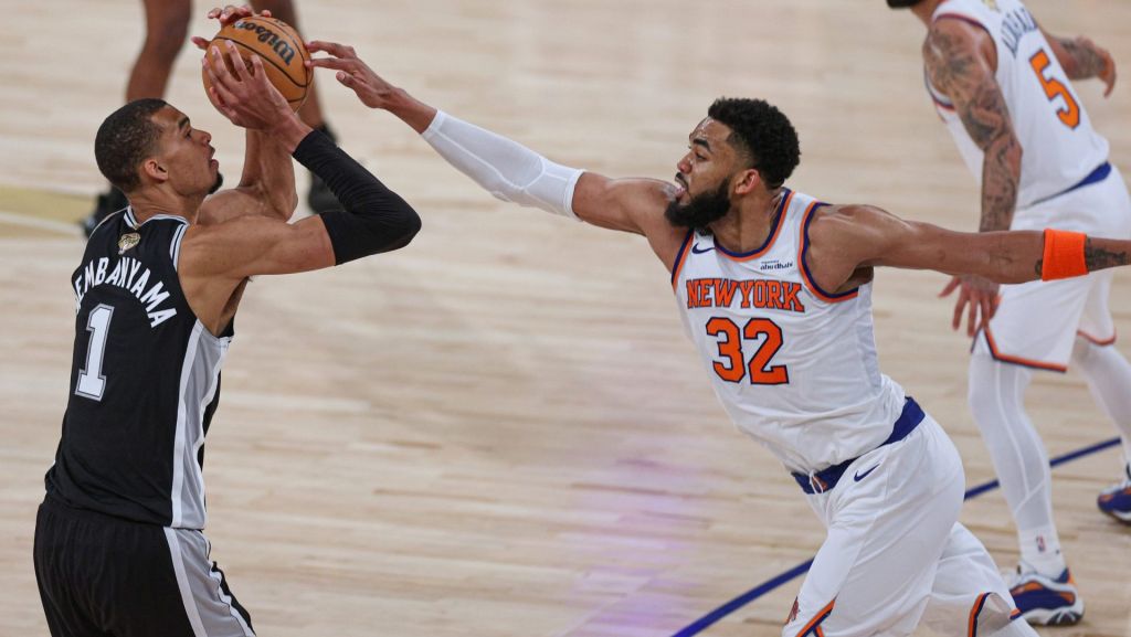Jun 8, 2026; New York, New York, USA; San Antonio Spurs forward Victor Wembanyama (1) shoots the ball as New York Knicks center Karl-Anthony Towns (32) defends during game three of the 2026 NBA Finals at Madison Square Garden. Mandatory Credit: Vincent Carchietta-Imagn Images