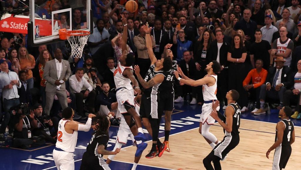 Jun 10, 2026; New York, New York, USA; New York Knicks forward Og Anunoby (8) scores on a rebound against San Antonio Spurs guard Dylan Harper (2) in the fourth quarter during game four of the 2026 NBA Finals at Madison Square Garden. Mandatory Credit: Geoff Burke-Imagn Images