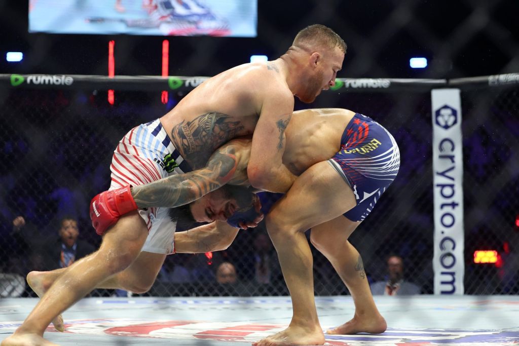 Jun 14, 2026; Washington, D.C., USA; Justin Gaethje (blue gloves) fights Ilia Topuria (red gloves) during the UFC Freedom 250 at the White House South Lawn.