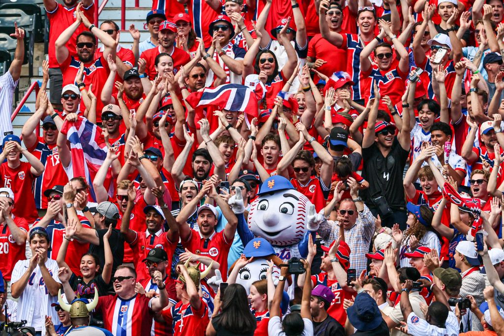 Jun 24, 2026; New York City, New York, USA; Norway national soccer team fans show support accompanied by Mr. and Mrs. Met during the MLB game between the New York Mets and the Chicago Cubs at Citi Field.