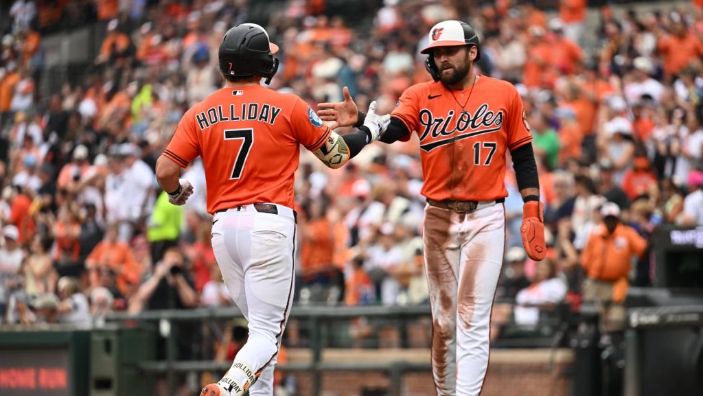 Jun 28, 2026; Baltimore, Maryland, USA; Baltimore Orioles outfielder Colton Cowser (17) congratulates infielder Jackson Holliday (7) at home plate after Holliday hit a two-run home run in the seventh inning against the Washington Nationals at Oriole Park at Camden Yards.