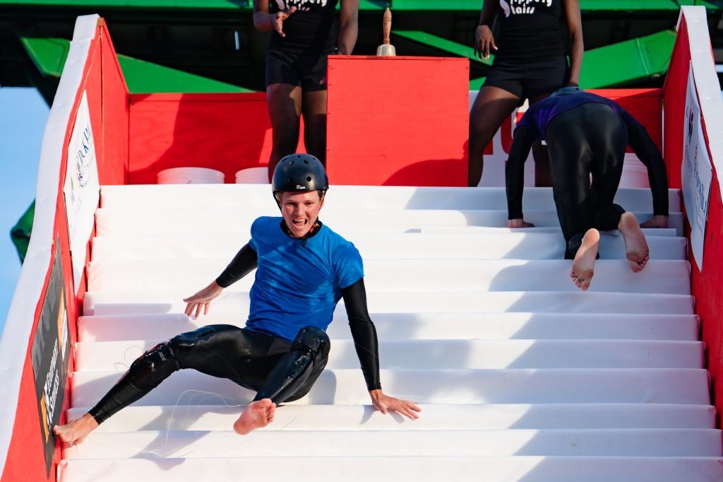 Rock Hill, SC - August 5, 2022 - Manchester Meadows: Athletes competing in Slippery Stairs at The Ocho during the 2022 ESPN: The Ocho