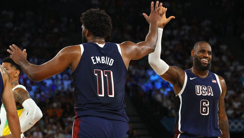 Paris 2024 Olympics - Basketball - Men's Quarterfinal - Brazil vs United States - Bercy Arena, Paris, France - August 06, 2024. Joel Embiid of United States and Lebron James of United States react during the match. REUTERS/Brian Snyder