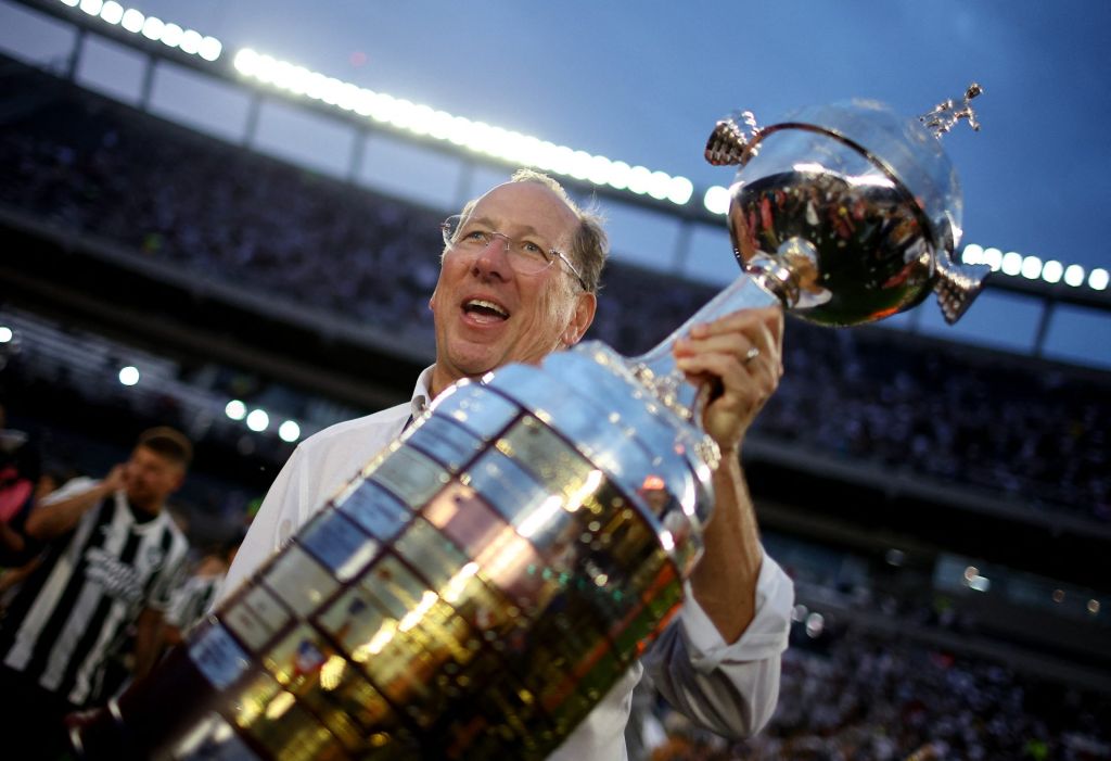 Soccer - Copa Libertadores - Final - Atletico Mineiro v Botafogo - Estadio Mas Monumental, Buenos Aires, Argentina - November 30, 2024 Botafogo owner John Textor celebrates with the trophy after winning the Copa Libertadores