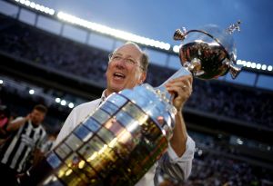 Soccer - Copa Libertadores - Final - Atletico Mineiro v Botafogo - Estadio Mas Monumental, Buenos Aires, Argentina - November 30, 2024 Botafogo owner John Textor celebrates with the trophy after winning the Copa Libertadores