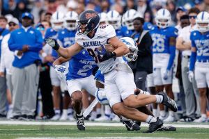 Aug 30, 2025; Colorado Springs, Colorado, USA; Bucknell Bison tight end Charlie Kreinbucher (82) runs the ball against Air Force Falcons defensive back Roger Jones Jr. (5) in the first quarter at Falcon Stadium.