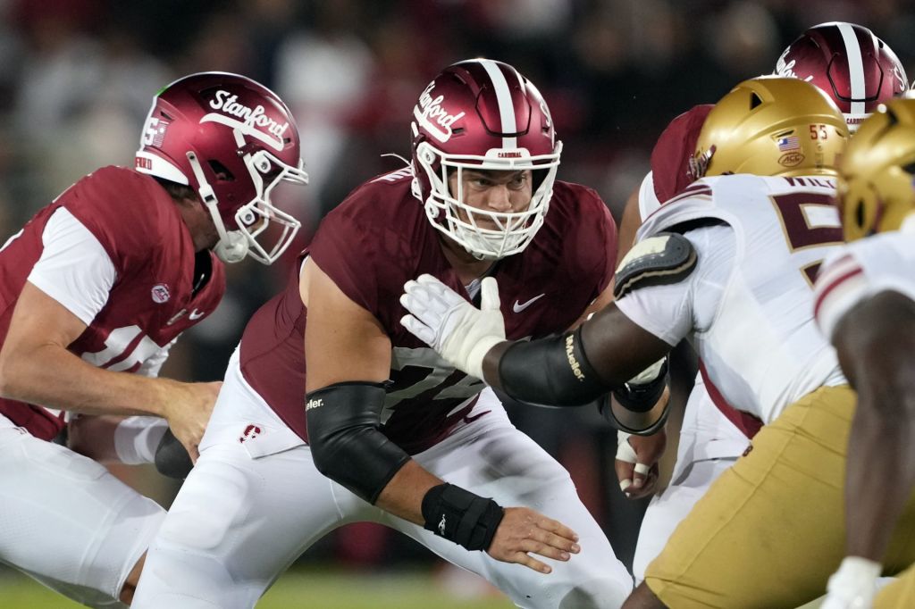 Sep 13, 2025; Stanford, California, USA; Stanford Cardinal offensive lineman Fisher Anderson (center) blocks against Boston College Eagles defensive lineman Kwan Williams (right) during the fourth quarter at Stanford Stadium.