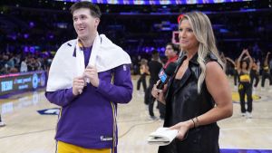Oct 24, 2025; Los Angeles, California, USA; NBA on Prime reporter Allie Clifton (right) interviews Los Angeles Lakers guard Austin Reaves (15) after the game against the Minnesota Timberwolves at Crypto.com Arena. Mandatory Credit: Kirby Lee-Imagn Images