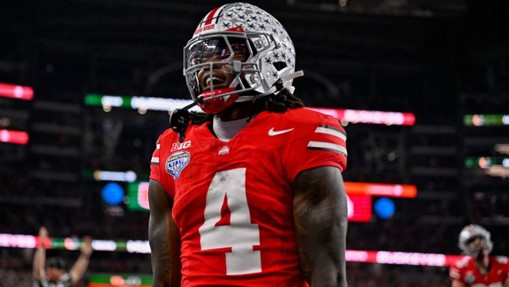 Dec 31, 2025; Arlington, TX, USA; Ohio State Buckeyes wide receiver Jeremiah Smith (4) celebrates after he runs for a touchdown during the 2025 Cotton Bowl and quarterfinal game of the College Football Playoff at AT&T Stadium. Mandatory Credit: Jerome Miron-Imagn Images