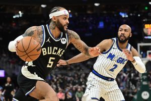Mar 8, 2026; Milwaukee, Wisconsin, USA; Milwaukee Bucks forward Gary Trent Jr. (5) drives for the basket against Orlando Magic guard Jevon Carter (2) in the first quarter at Fiserv Forum.