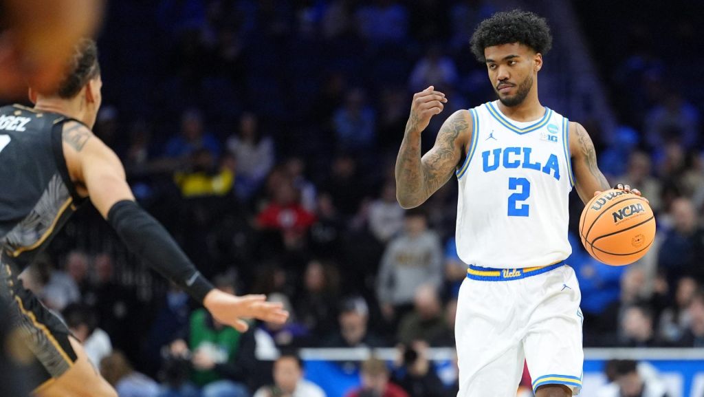 Mar 20, 2026; Philadelphia, PA, USA; UCLA Bruins guard Donovan Dent (2) dribbles the ball against the UCF Knights in the first half during a first round game of the men's 2026 NCAA Tournament at Xfinity Mobile Arena