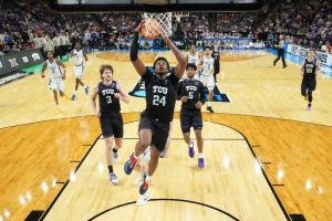 Mar 21, 2026; Greenville, SC, USA; Texas Christian University Horned Frogs forward Xavier Edmonds (24) dunks the ball during the second half against Duke Blue Devils forward Maliq Brown (6) during a second round game of the men's 2026 NCAA Tournament at Bon Secours Wellness Arena.