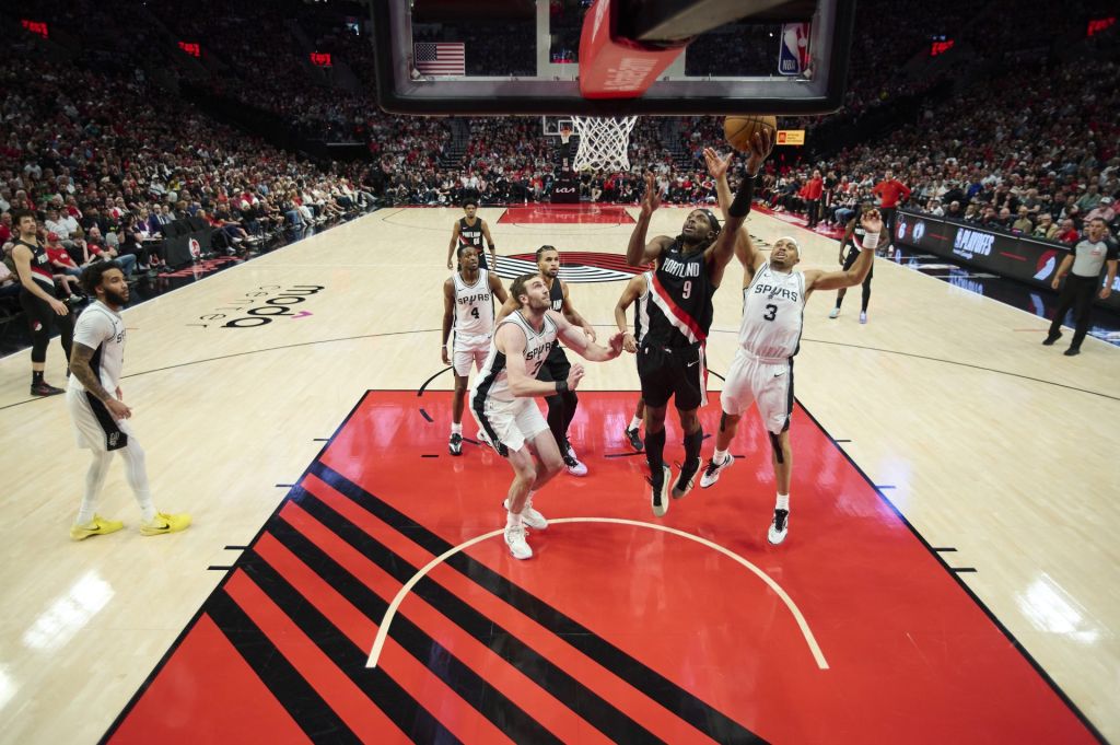 Apr 26, 2026; Portland, Oregon, USA; Portland Trail Blazers forward Jerami Grant (9) scores a basket during the second half against San Antonio Spurs forward Keldon Johnson (3) during game four of the first round of the 2026 NBA Playoffs at Moda Center.