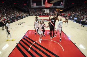 Apr 26, 2026; Portland, Oregon, USA; Portland Trail Blazers forward Jerami Grant (9) scores a basket during the second half against San Antonio Spurs forward Keldon Johnson (3) during game four of the first round of the 2026 NBA Playoffs at Moda Center.
