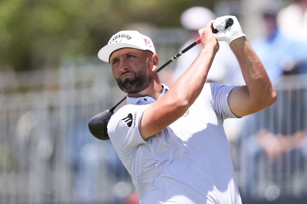 Jun 17, 2026; Southampton, New York, USA; Jon Rahm plays his tee shot on hole 15 during a practice round for the U.S. Open golf tournament.