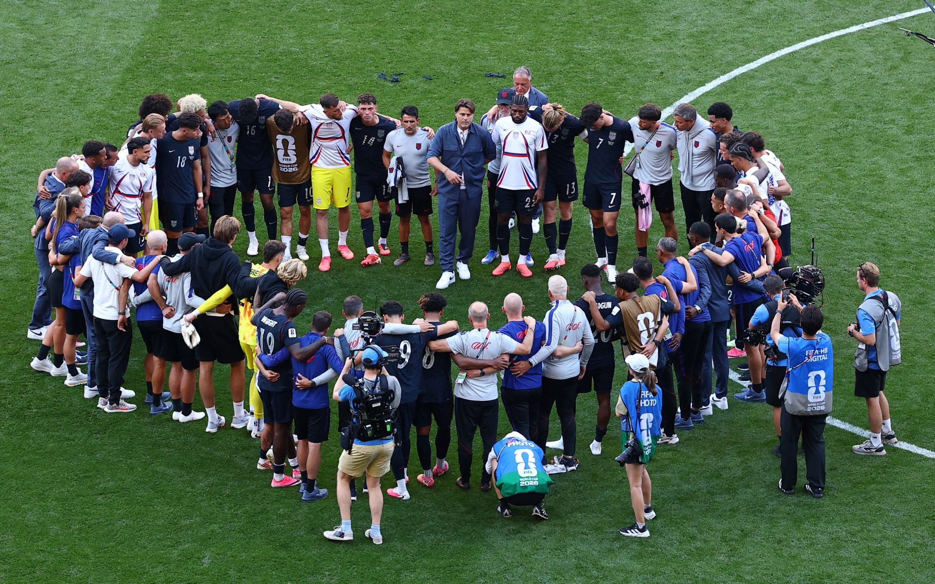 Soccer Football - FIFA World Cup 2026 - Round of 16 - United States v Belgium - Seattle Stadium, Seattle, Washington, U.S. - July 6, 2026 U.S. coach Mauricio Pochettino speaks to the team after the match as the U.S. are eliminated from the World Cup