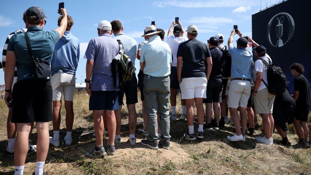 Golf - The 154th Open Championship - Royal Birkdale Golf Club, Southport, Britain - July 13, 2026 General view of fans taking photographs with their mobile phones during practice REUTERS/Andrew Boyers