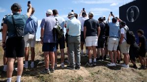 Golf - The 154th Open Championship - Royal Birkdale Golf Club, Southport, Britain - July 13, 2026 General view of fans taking photographs with their mobile phones during practice REUTERS/Andrew Boyers