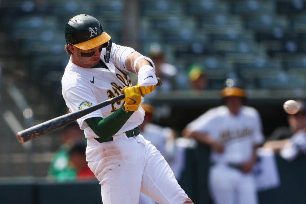 Jul 19, 2026; West Sacramento, California, USA; Athletics shortstop Jacob Wilson (5) hits an RBI single during the ninth inning against the Washington Nationals at Sutter Health Park.