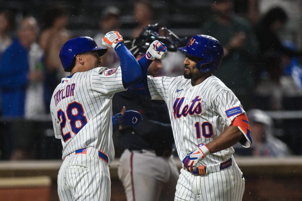 Jul 27, 2026; New York City, New York, USA; New York Mets second baseman Marcus Semien (10) is greeted at home plate by center fielder Tyrone Taylor (28) after hitting a two run home run against the Atlanta Braves during the sixth inning at Citi Field.