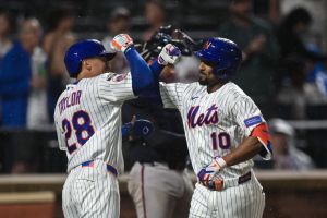 Jul 27, 2026; New York City, New York, USA; New York Mets second baseman Marcus Semien (10) is greeted at home plate by center fielder Tyrone Taylor (28) after hitting a two run home run against the Atlanta Braves during the sixth inning at Citi Field.
