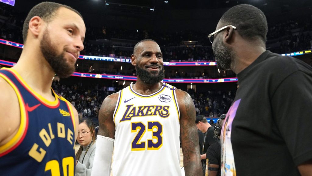 Jan 25, 2025; San Francisco, California, USA; Los Angeles Lakers forward LeBron James (23) talks with Golden State Warriors guard Stephen Curry (30) and forward Draymond Green (right) after the game at Chase Center. Mandatory Credit: Darren Yamashita-Imagn Images
