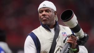 Dec 7, 2025; Atlanta, Georgia, USA; Hall of Fame outfielder Ken Griffey Jr. takes photos during a game between the Seattle Seahawks and Atlanta Falcons in the first quarter at Mercedes-Benz Stadium. Mandatory Credit: Brett Davis-Imagn Images