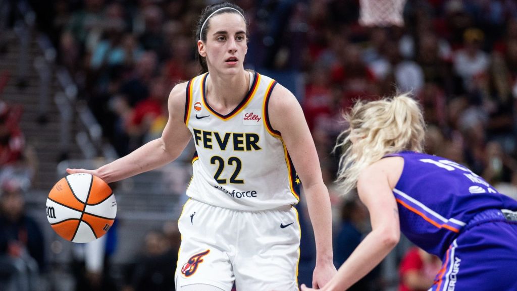 Jun 24, 2026; Indianapolis, Indiana, USA; Indiana Fever guard Caitlin Clark (22) dribbles the ball while Phoenix Mercury guard Lexi Held (10) defends in the second half at Gainbridge Fieldhouse. Mandatory Credit: Trevor Ruszkowski-Imagn Images
