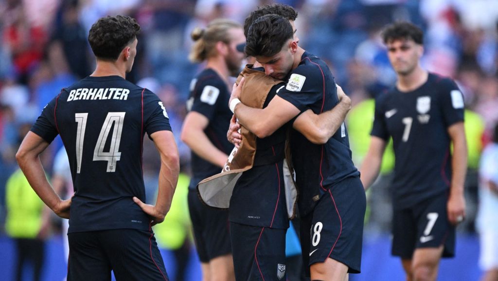 July 6, 2026; Seattle, Washington, U.S.; Christian Pulisic and Max Arfsten of the U.S. look dejected as they embrace after the match following their elimination from the World Cup. Mandatory Credit: Troy Wayrynen-Imagn Images