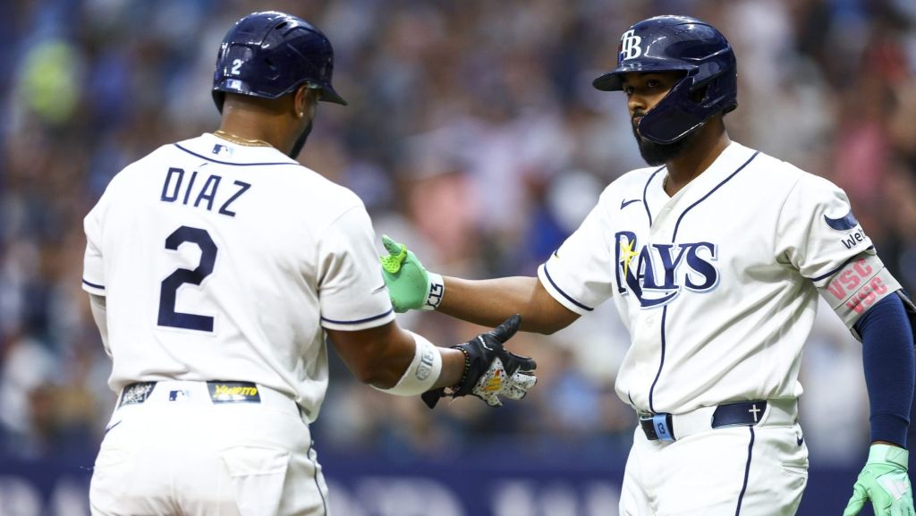 Jul 8, 2026; St. Petersburg, Florida, USA; Tampa Bay Rays third baseman Junior Caminero (13) greets designated hitter Yandy Diaz (2) after scoring a run against the New York Yankees in the third inning at Tropicana Field.