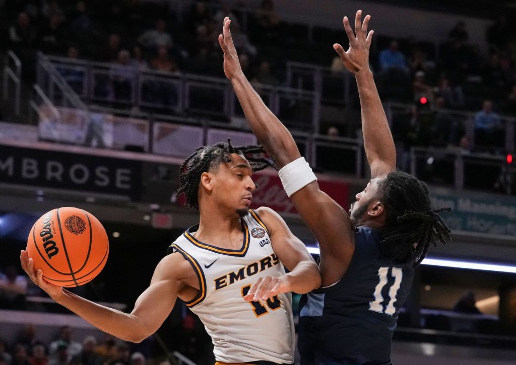 Emory Eagles guard Ben Pearce (10) passes around Mary Washington Eagles forward Jay Randall (11) on Sunday, April 5, 2026, during the NCAA DIII men's basketball championship game at Gainbridge Fieldhouse in Indianapolis.