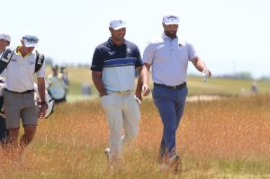 Jun 17, 2026; Southampton, New York, USA; Bryson DeChambeau (L) and Jon Rahm (R) walk together during a practice round for the U.S. Open golf tournament.
